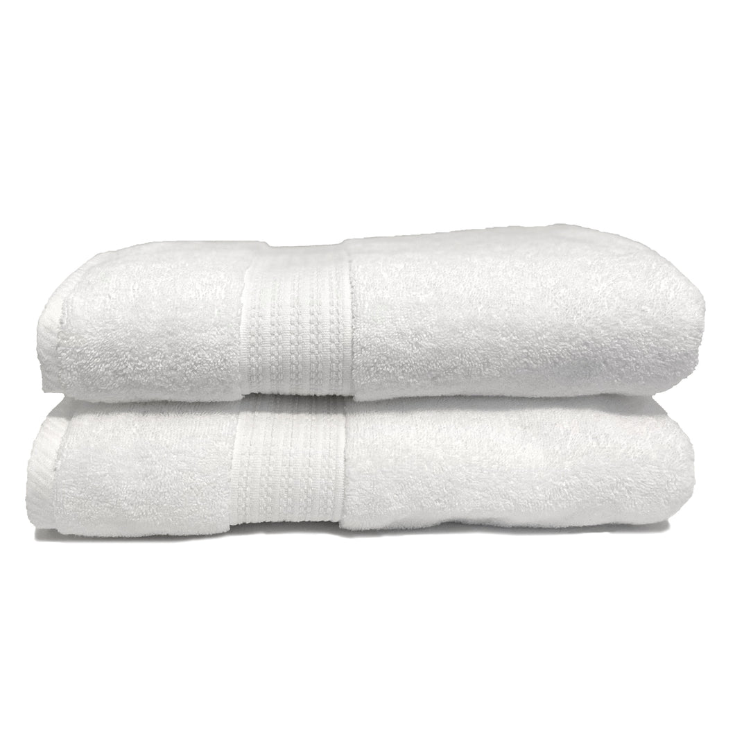 Two white spa collection towels folded up.