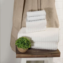 Load image into Gallery viewer, Six white towels on a towel rack in a bathroom. 
